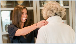 caregiver helping lady